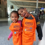 Pettit Kohn's youngest volunteers for USO Waves of Appreciation bag distribution at the airport 12/20/14