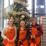 Pettit Kohn attorneys and staff distributing WOA goodie bags at the airport 12/20/14 (L to R: Jennifer S., Shannon F., Christina T.)