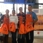 Pettit Kohn employees distributing WOA goodie bags to active-duty service members 12/20/14